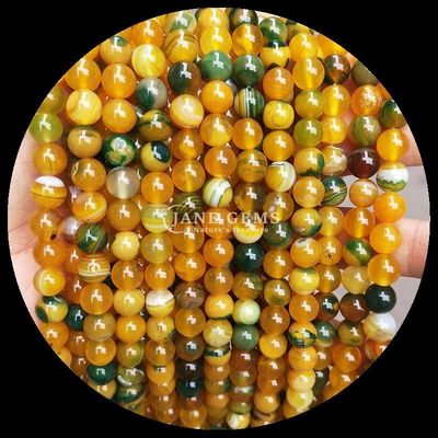 Meerdere kleuren ronde gesneden edelstenen kralen geel blauw gestreepte agaat voor doe-het-zelf sieraden maken en genezende armbanden